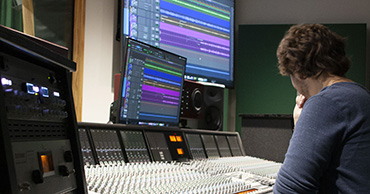 man at an audio editing set up