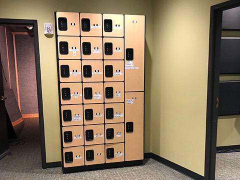 Wooden style lockers in the hallway between Studio B and Control Room 2 where audio equipment is stored