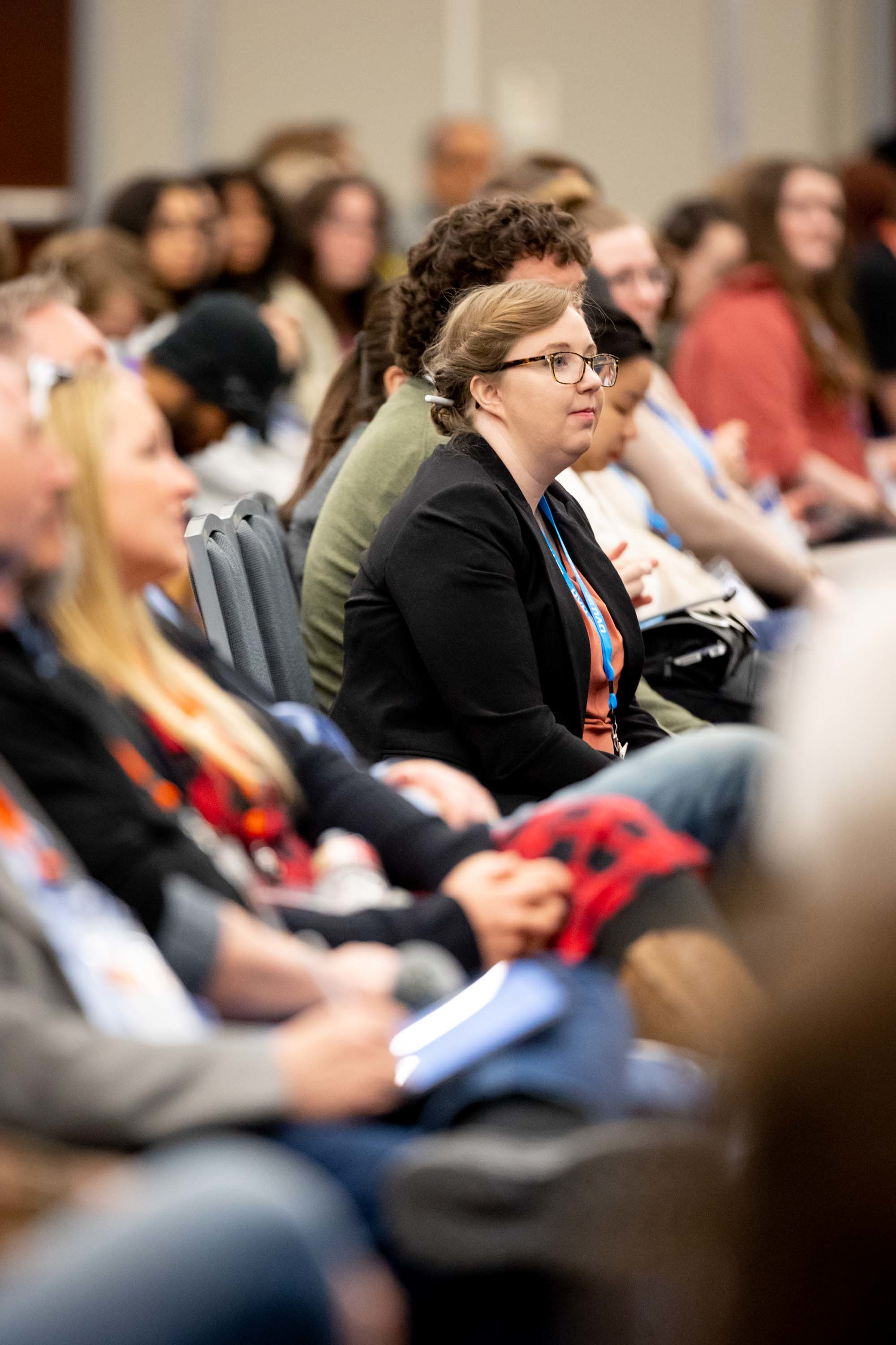 Student listening to a speaker