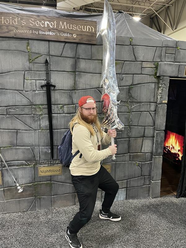 Chad posing with a sword