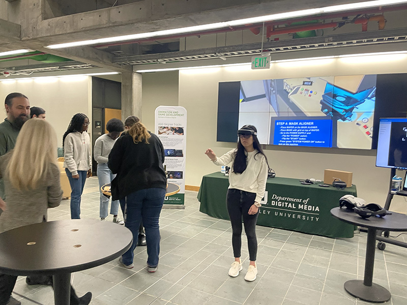 Students trying out the headsets at the info session