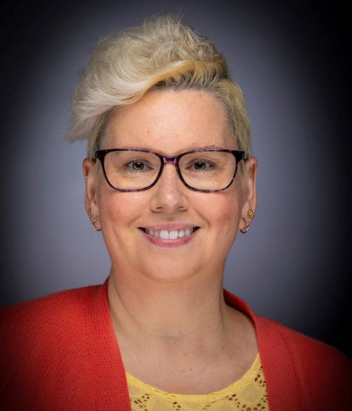 Photograph of Kellie Johnson female with short blonde hair and glasses