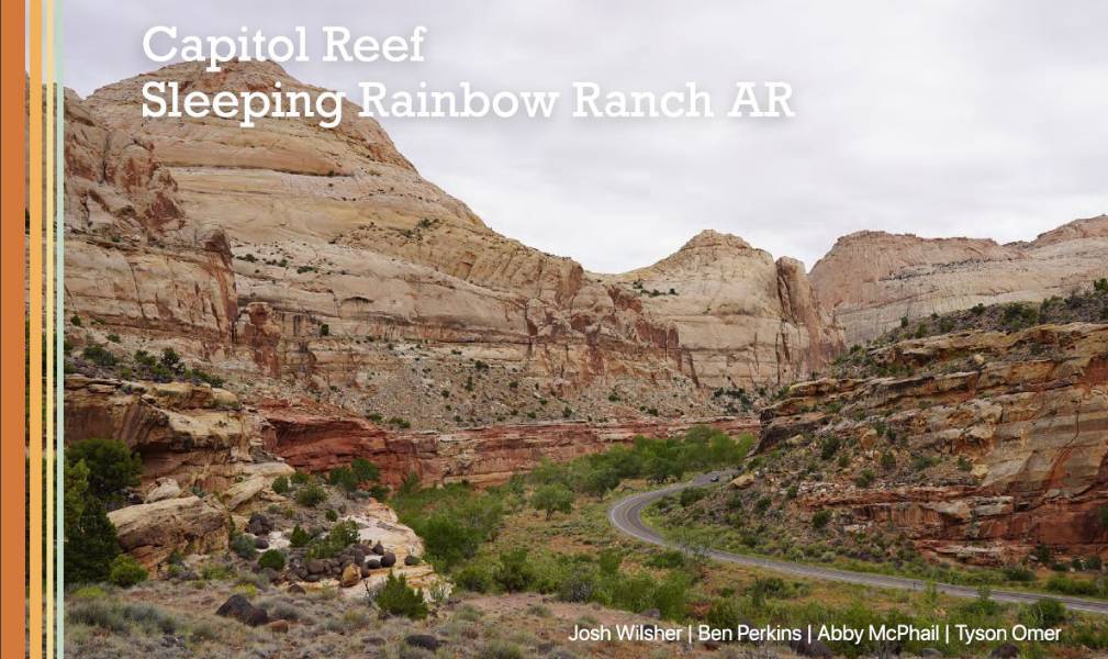 Scenic view of cliffs in Capitol Reef National Park with a road winding through the park