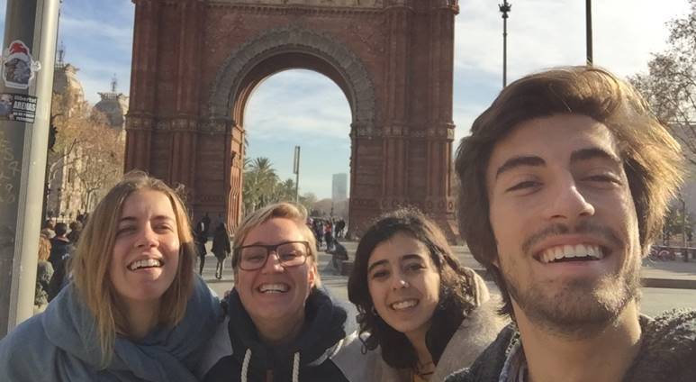 UVU exchange students posing in front of an arch