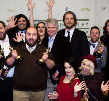 Faculty member Dennis Lisonbee (center) surrounded by film festival winners