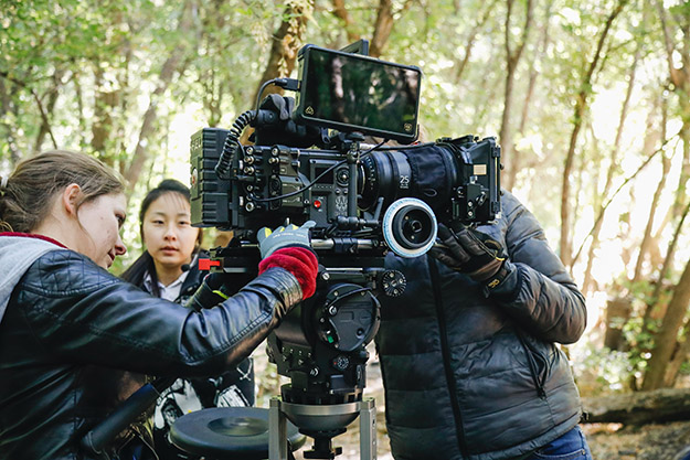 woman with a camera on set