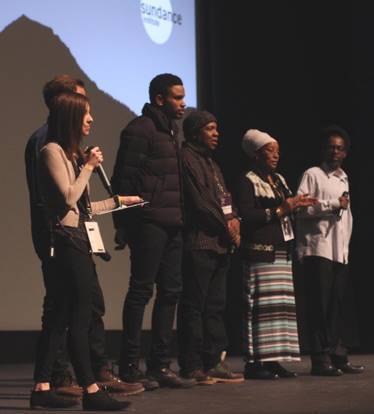 Aimee Olsen on stage with filmmakers