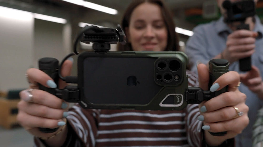 Close up on student holding camera