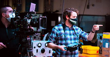 man directing a film