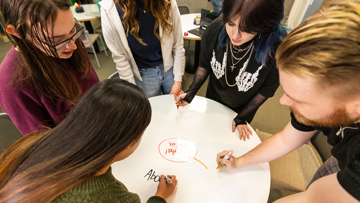 group of students working around a table