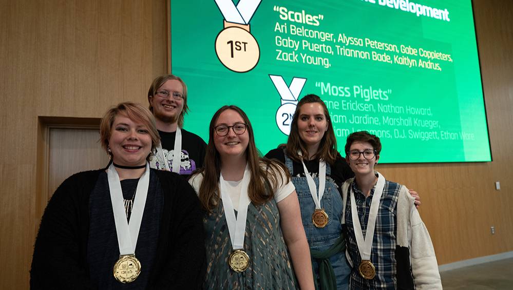 5 students wearing medals