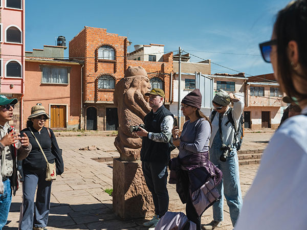 students with cameras in a plaza
