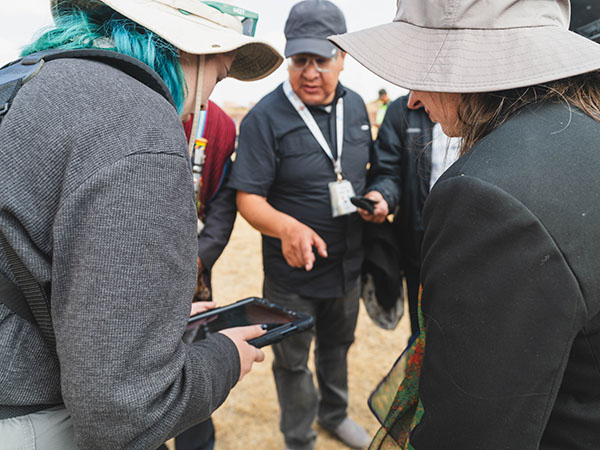 student showcasing work on a tablet