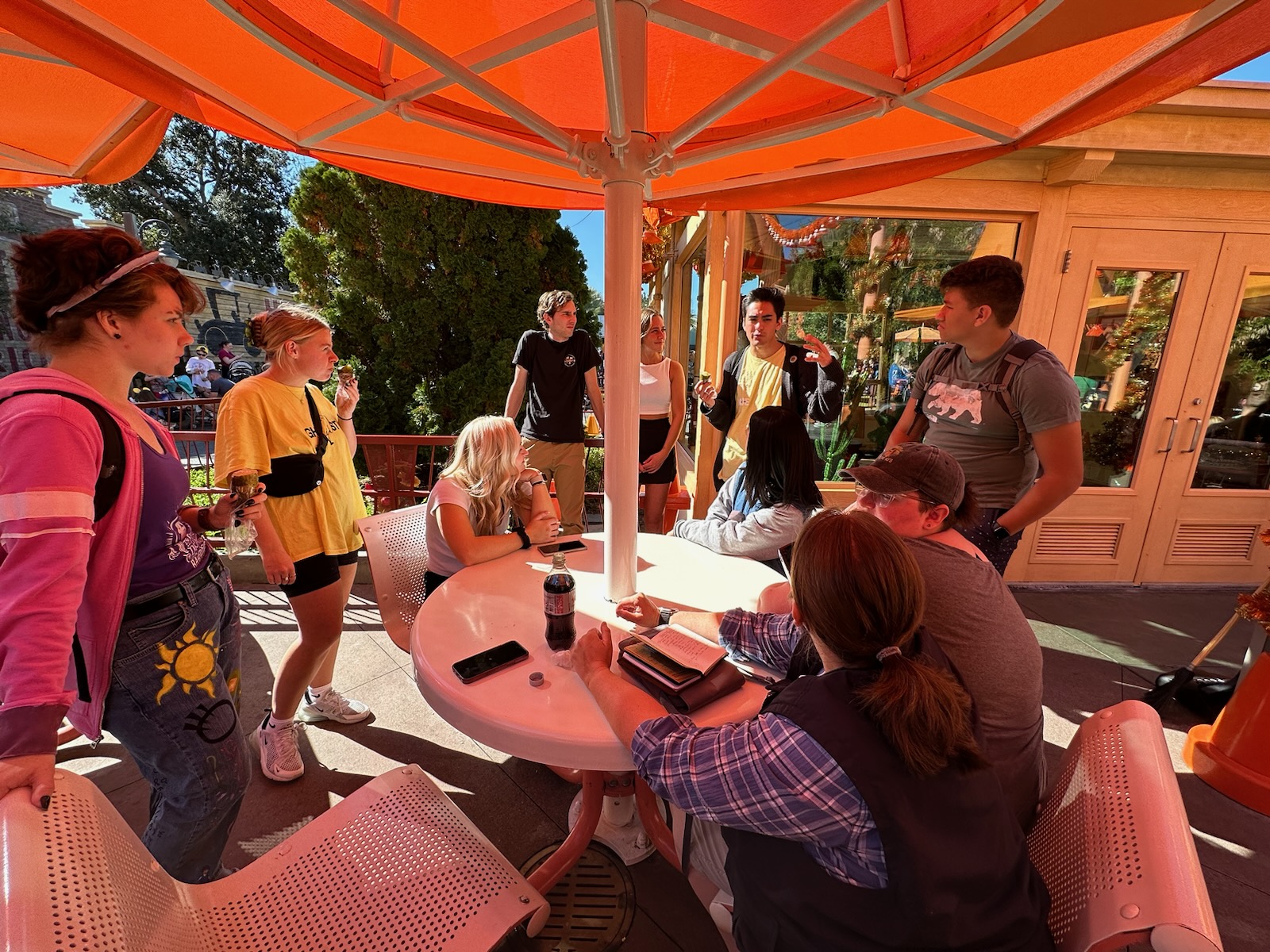 students in front of flos cafe in disneyland