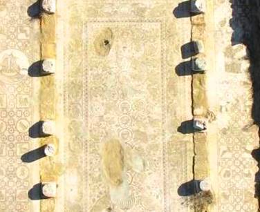 Arial view of mosaic church floor and ruined columns on either side
