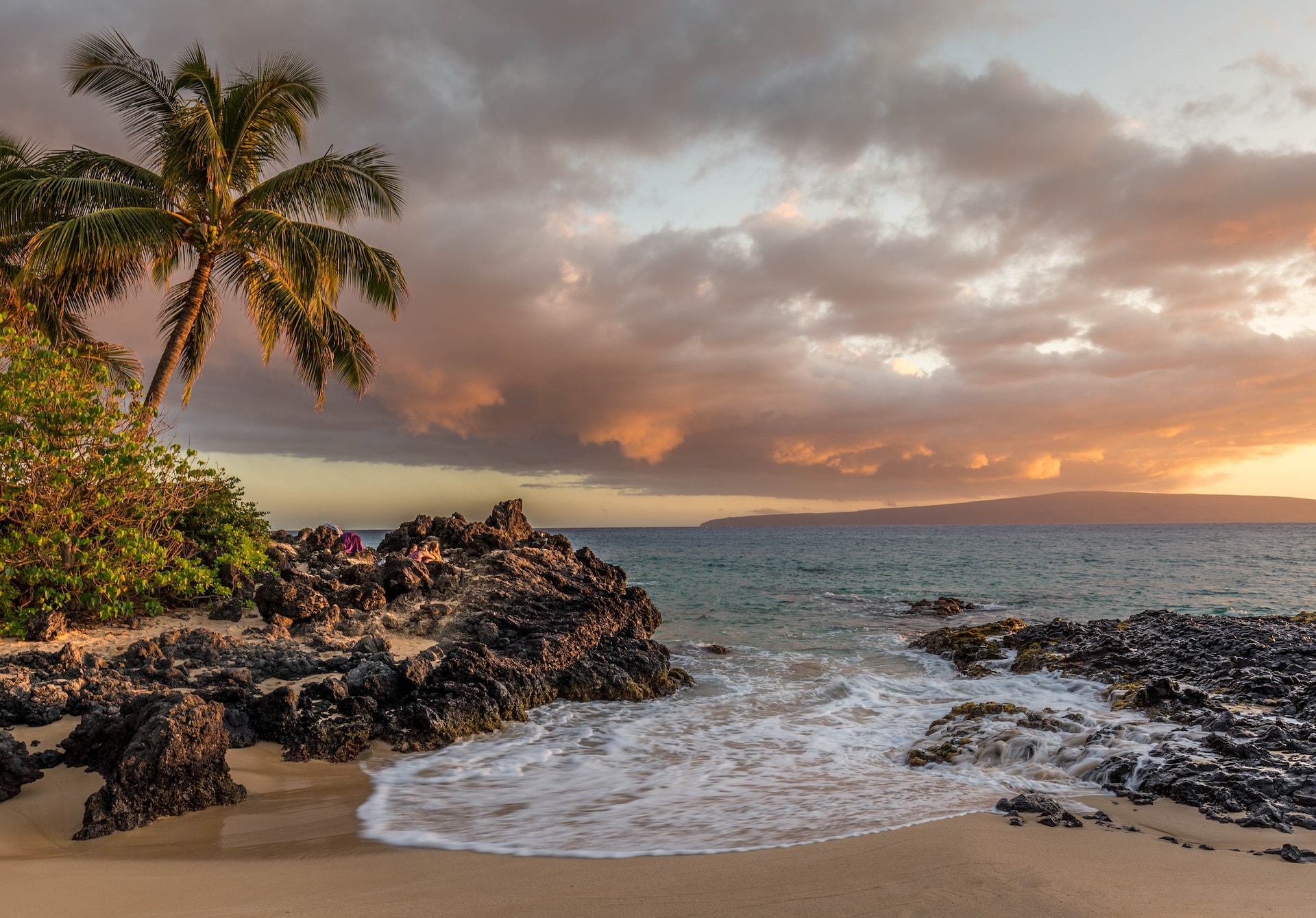 A picture of a beach at sunset.