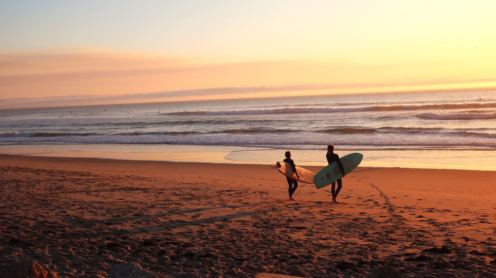 A picture of a beach at sunset.