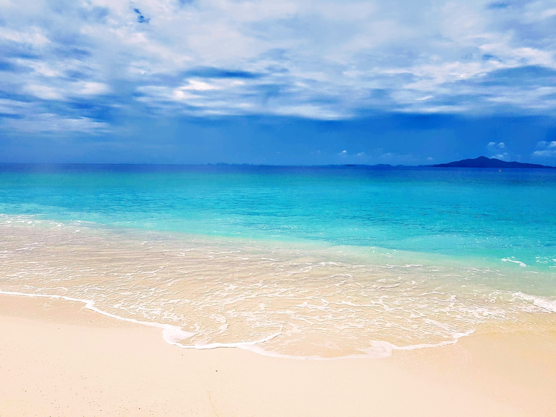 A picture of a beach at sunset.