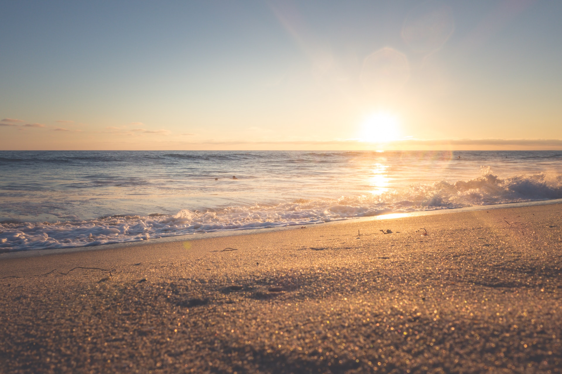 A picture of a beach at sunset.