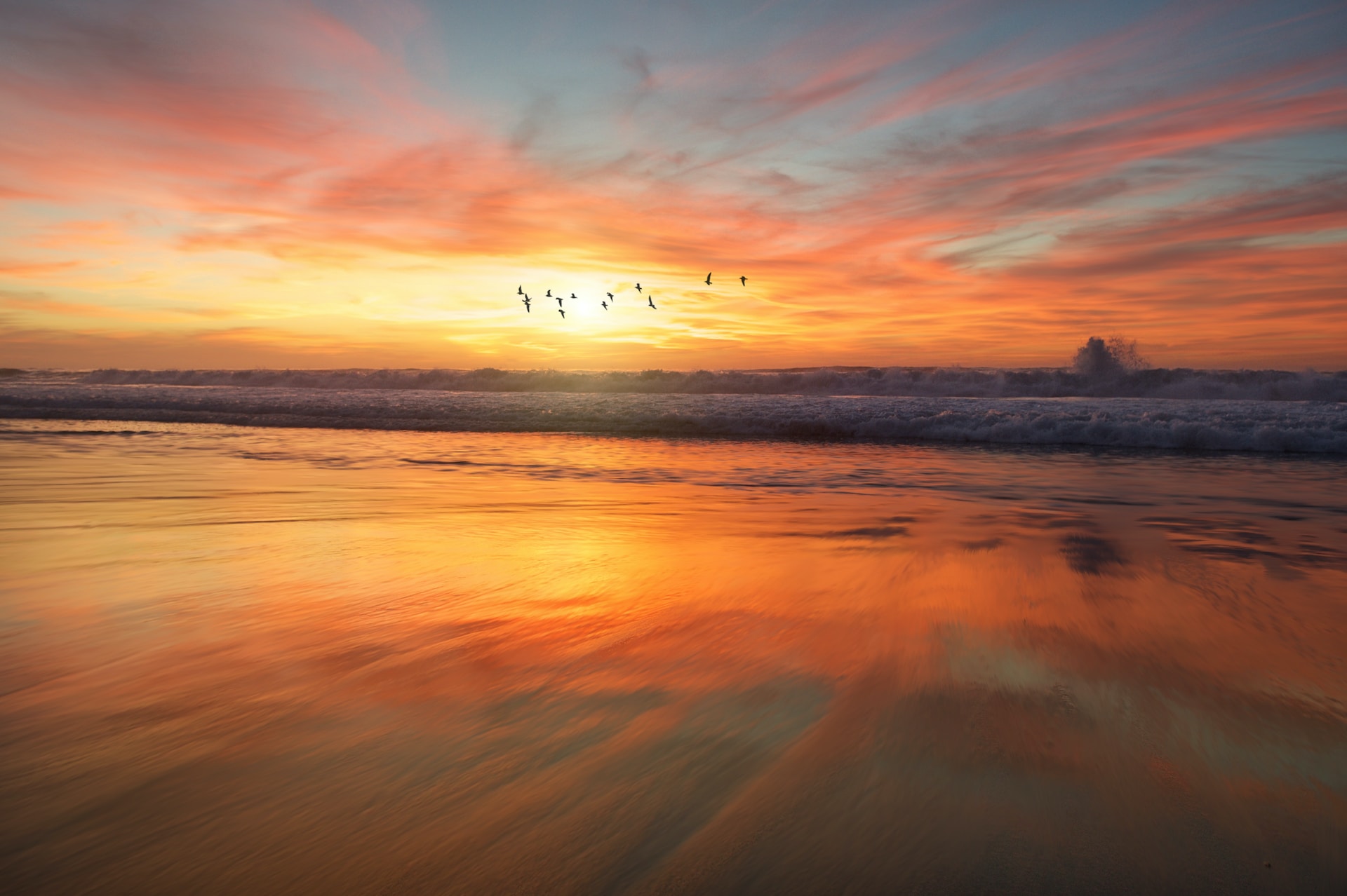 A picture of a beach at sunset.