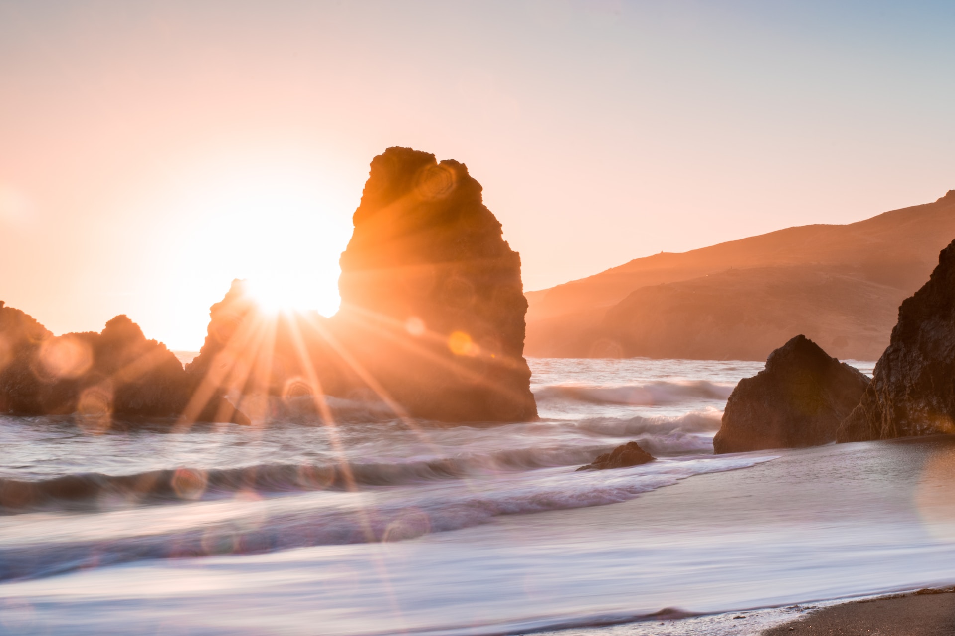 A picture of a beach at sunset.