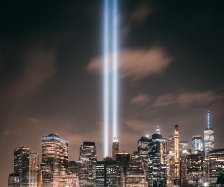 The 9/11 Memorial at night.