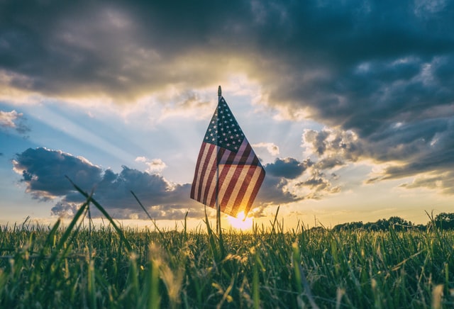 A flag planted in the ground. 