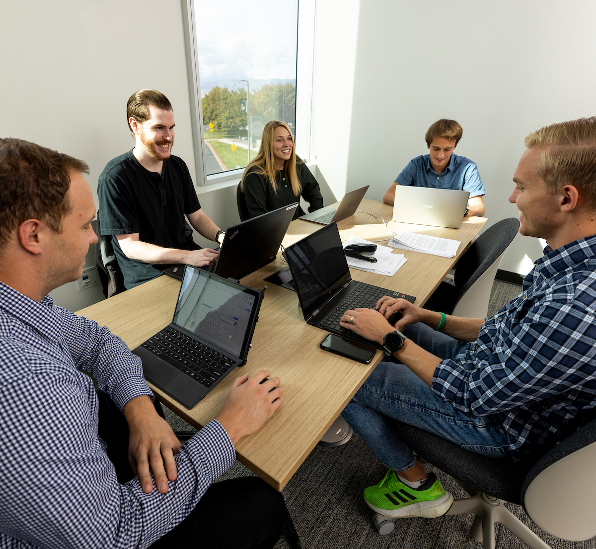 students huddled around a table
