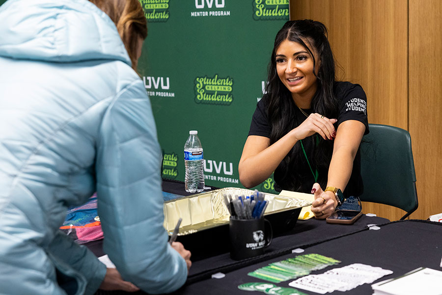 Image of a person giving instructions at a booth