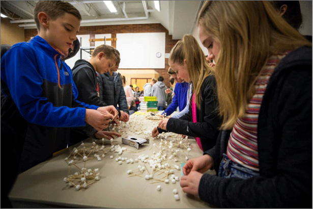 Children building models of molecules with marshmallows and toothpicks