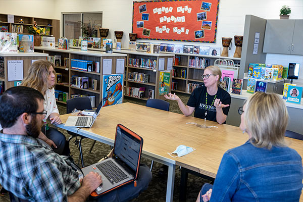 Faculty and staff in a meeting