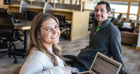 Students smiling towards the camera.