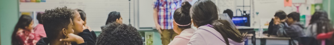 Elementary classroom of children looking at the teacher