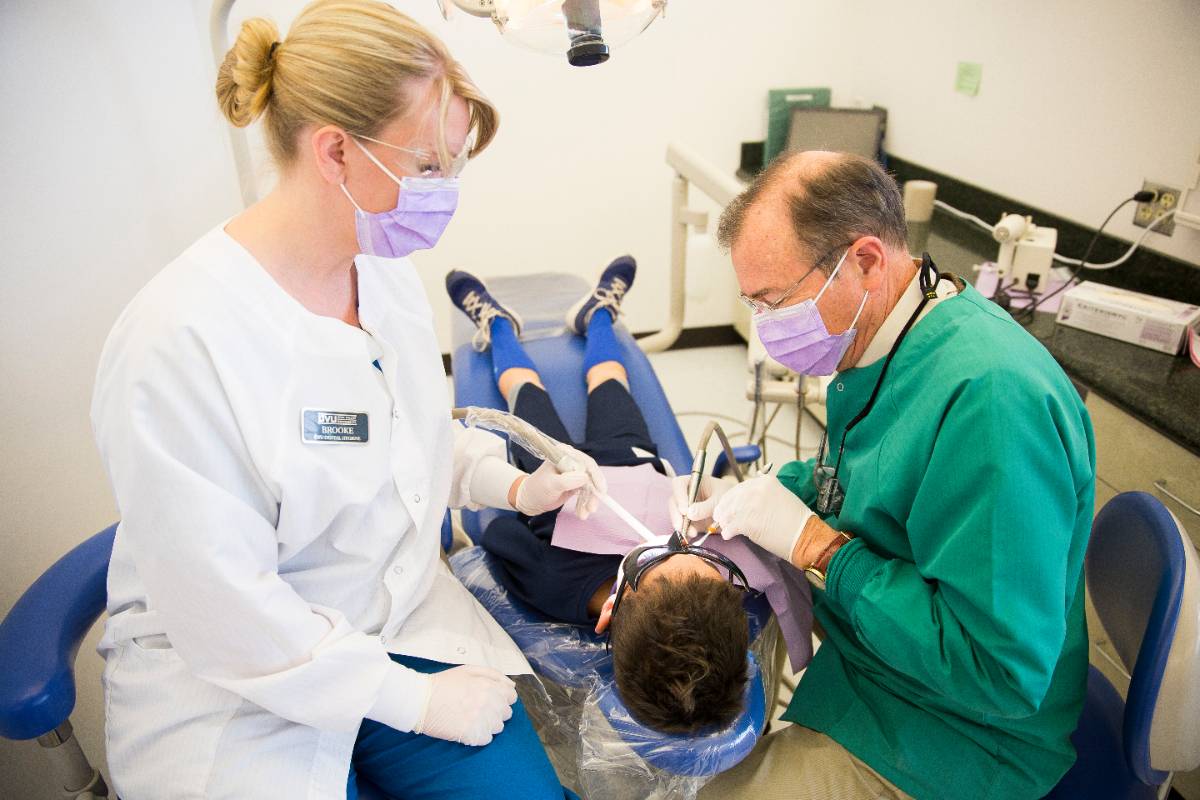 dental student working on a patient