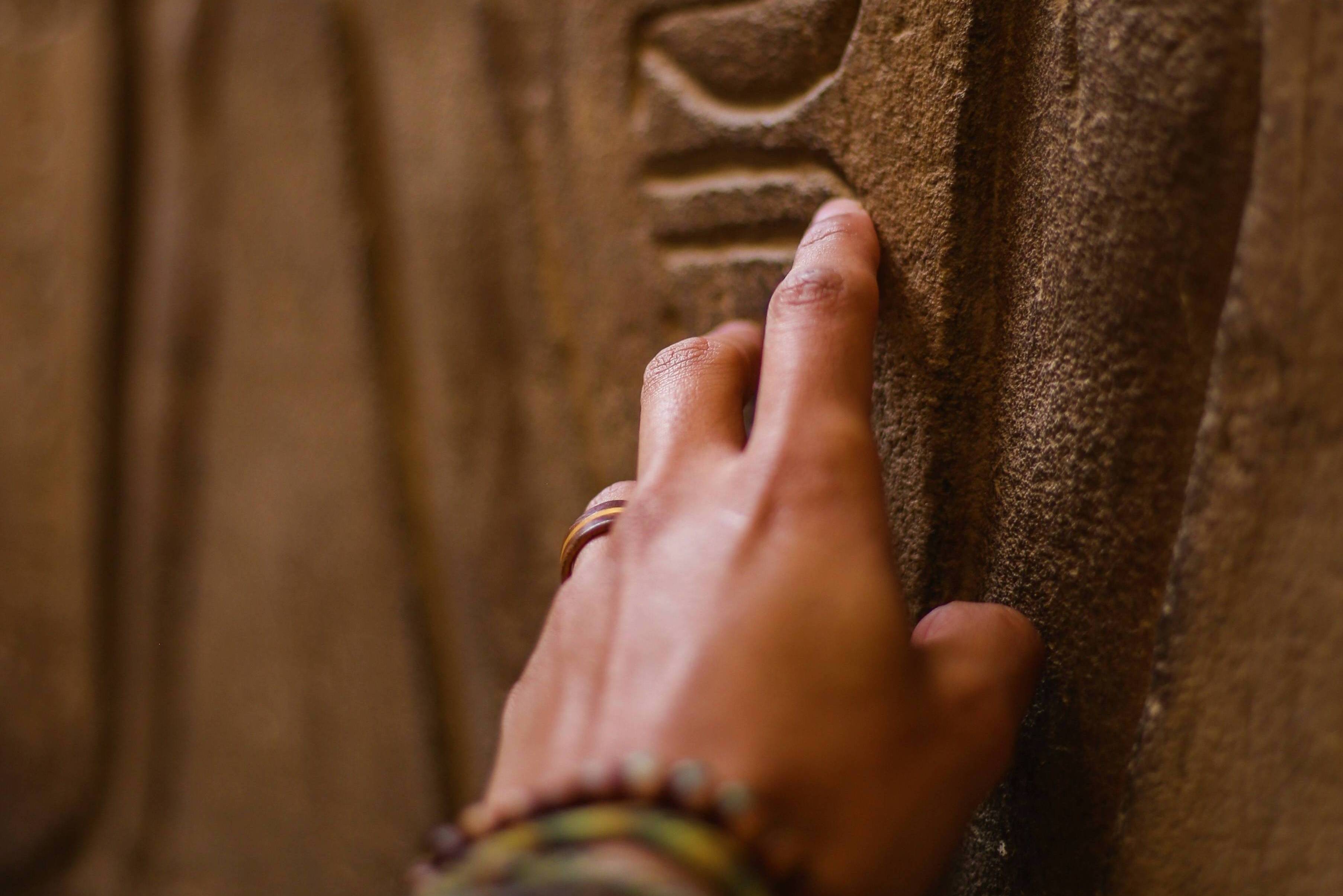 Hand Touching Stone Hieroglyphs