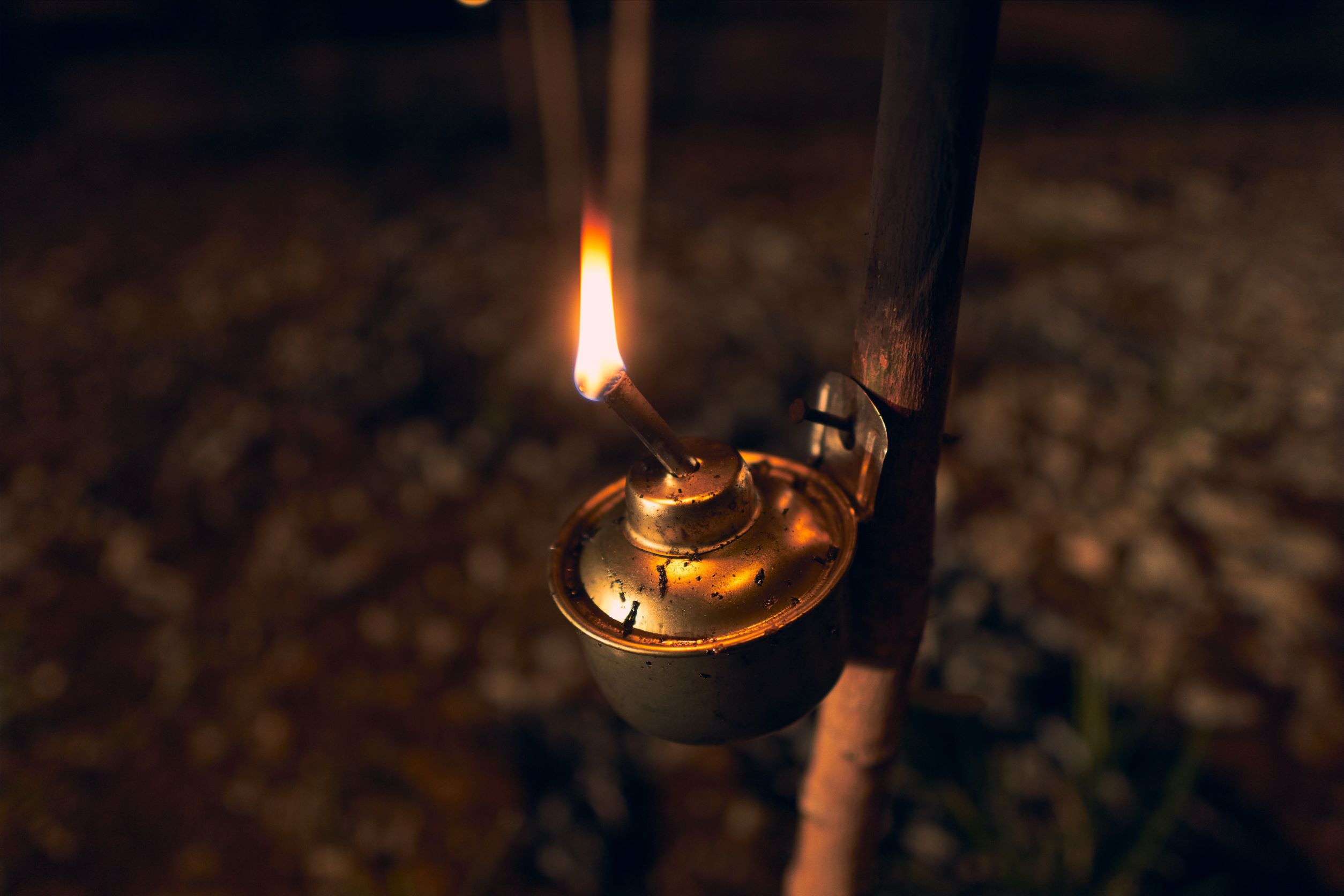 Gas lamp hanging on a stick - image by Ihsan Adityawarman from Pexel