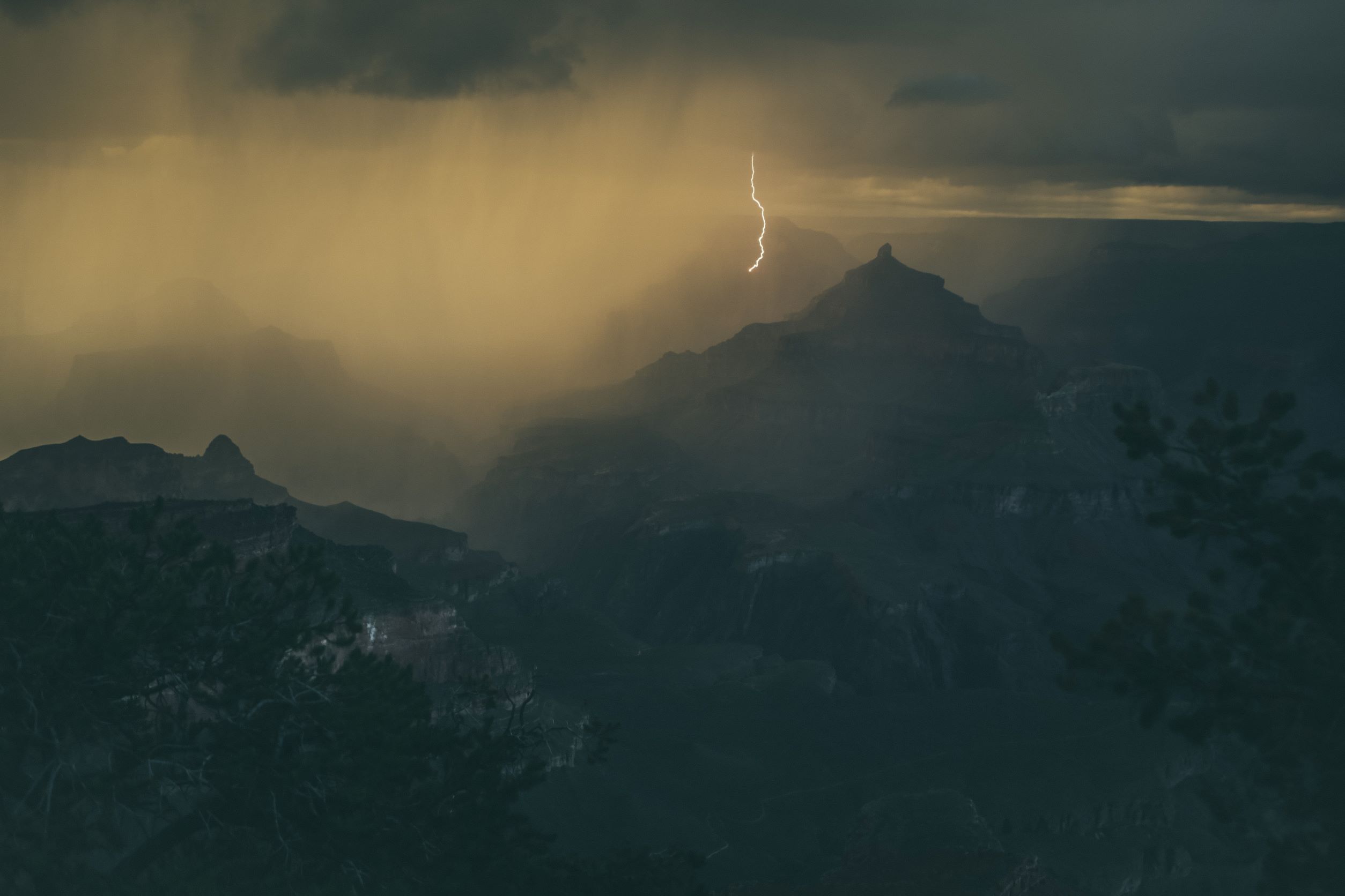 Lightning striking remote mountain top - Image by Tim Trad from Unsplash