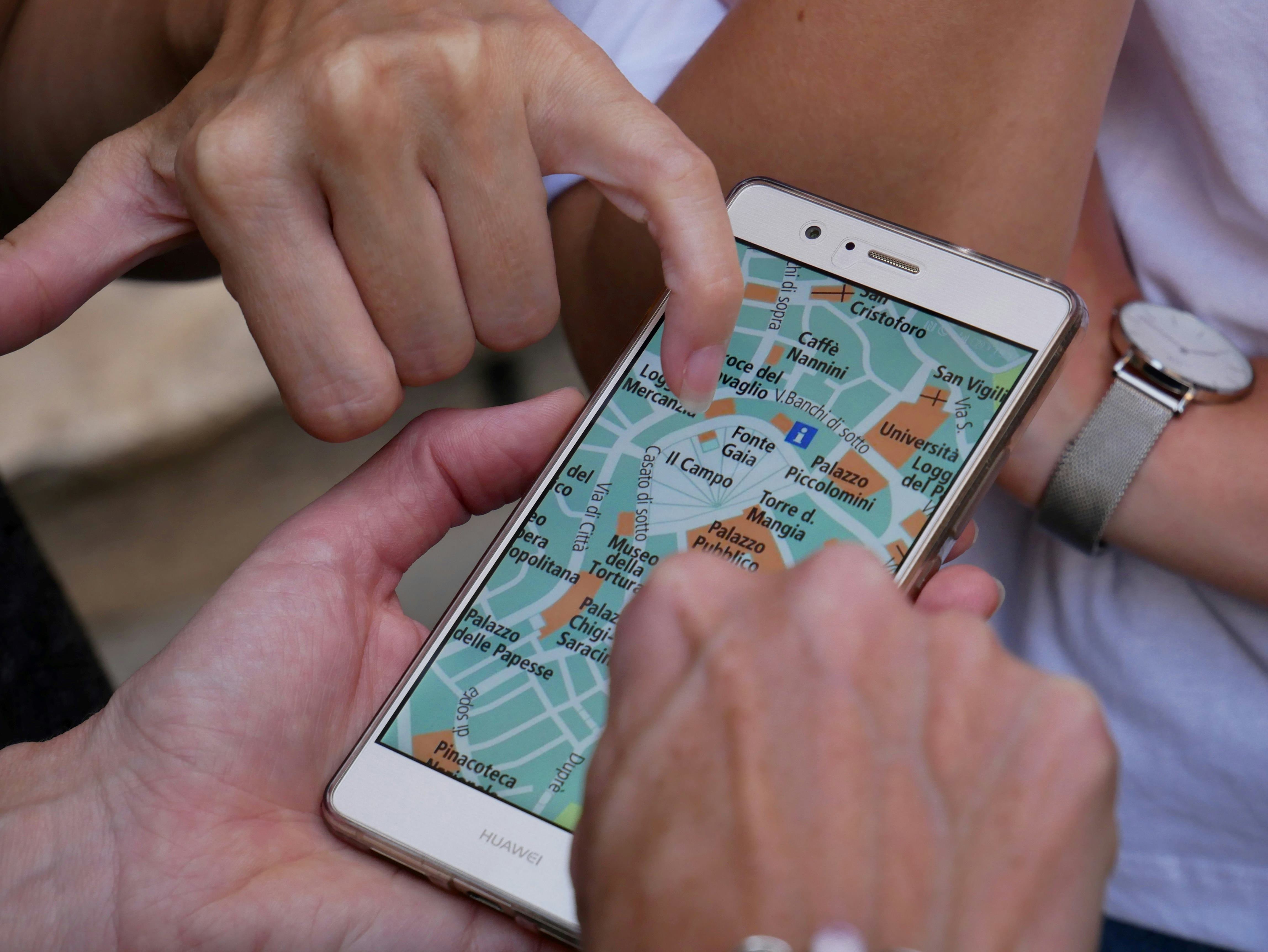 People Looking at a phone screen