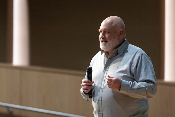 Brent Baum speaking in front of an audience