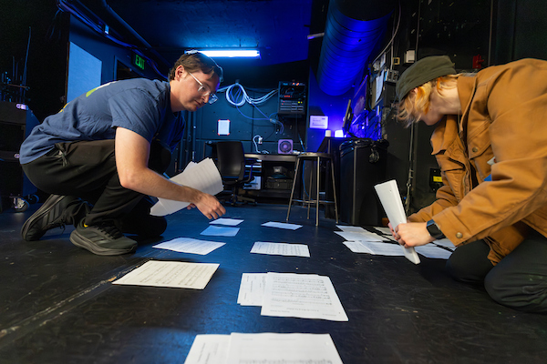 Students in a film studio looking at papers