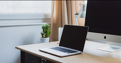 Desk with some computers on it