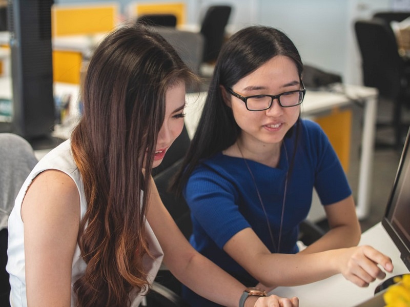 Two students working together on an assignment