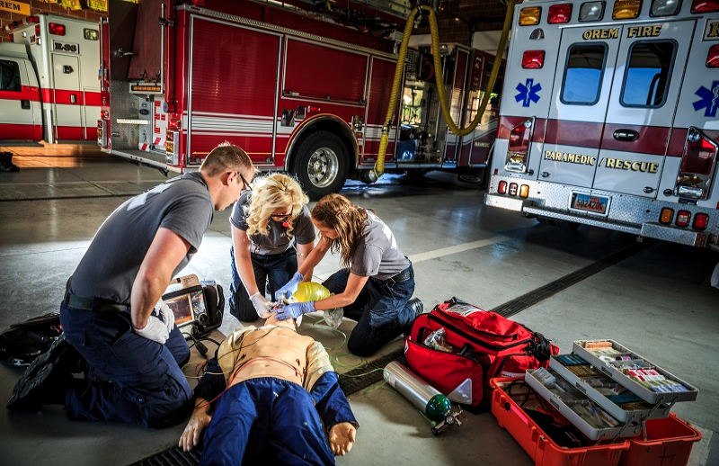 Paramedics practicing on a Dummy