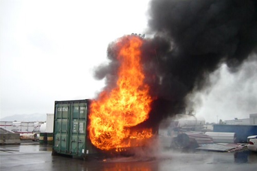 fire coming out of a shipping container