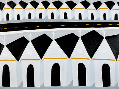 A row of white houses with crosses on top