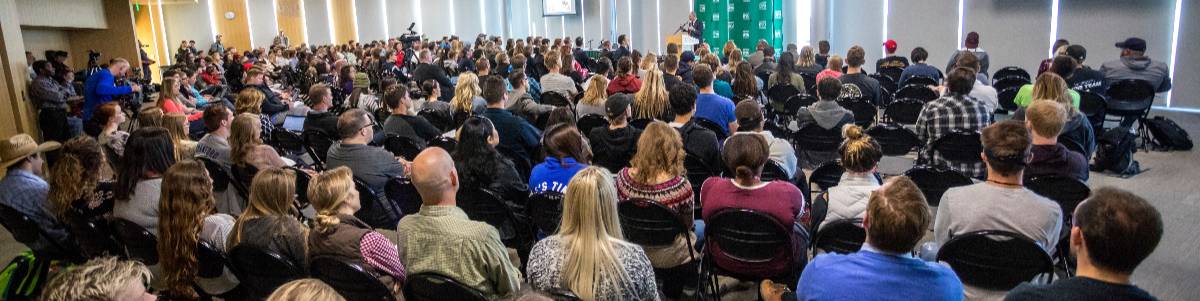 audience listening to a speaker 