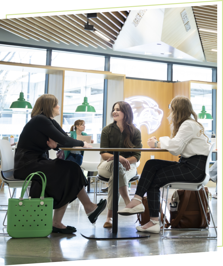 students sitting at table talking