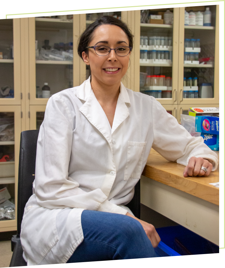image of Marcy Brooks in lab coat and in lab