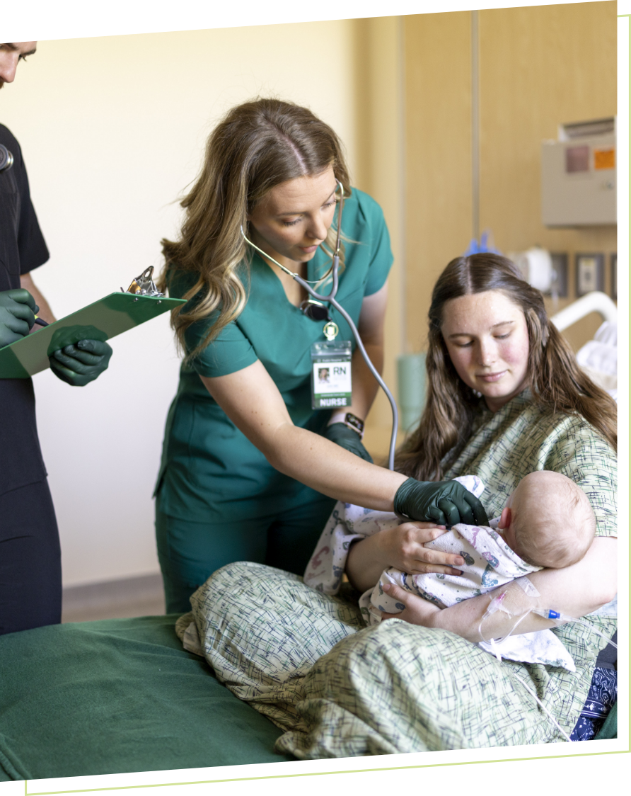 nurse attending mother and baby