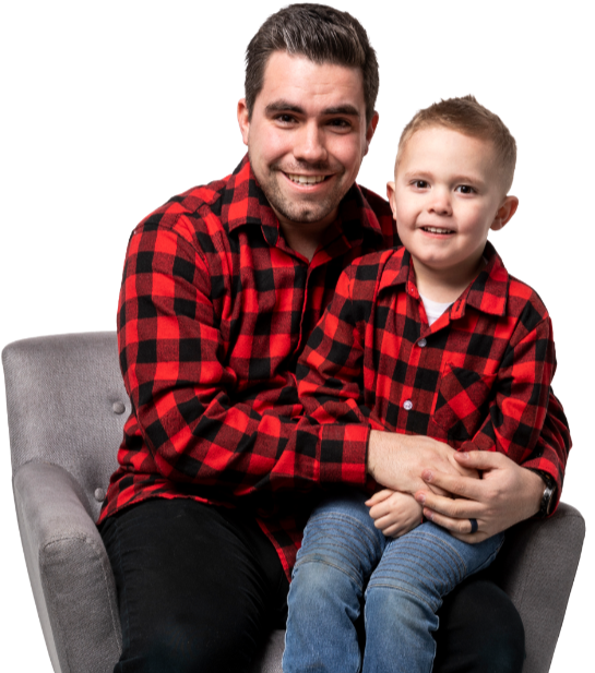 Joshua and his son sitting in a chair together